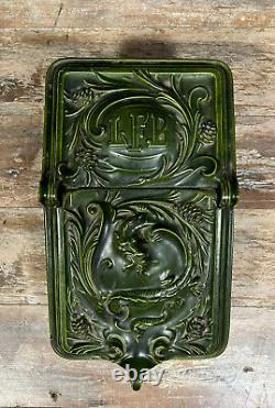 Old enamelled cast iron coal reserve in Renaissance style from the 19th century