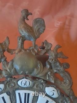 Old pendulum movement of a Comtoise clock with rooster from the 18th century dated 1788