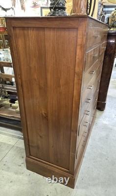 Old tradesman’s chest of drawers in solid oak, 19th century