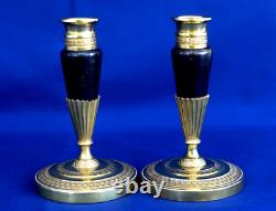 Pair of Empire-era candlesticks for the toilet table, gilt and patinated bronze, 19th century