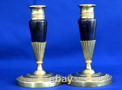 Pair of Empire-era candlesticks for the toilet table, gilt and patinated bronze, 19th century