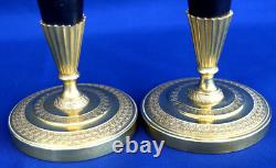 Pair of Empire-era candlesticks for the toilet table, gilt and patinated bronze, 19th century