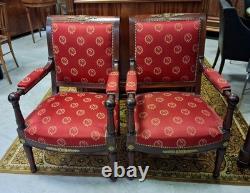 Pair of Empire-period mahogany armchairs with Napoleonic emblems, 19th century