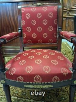 Pair of Empire-period mahogany armchairs with Napoleonic emblems, 19th century