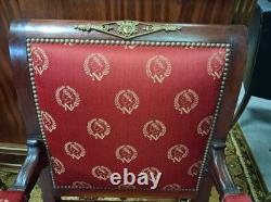 Pair of Empire-period mahogany armchairs with Napoleonic emblems, 19th century