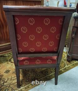 Pair of Empire-period mahogany armchairs with Napoleonic emblems, 19th century