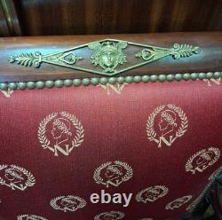 Pair of Empire-period mahogany armchairs with Napoleonic emblems, 19th century