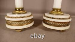 Pair of Louis XVI candle holders in white marble and gilded brass, 19th century period
