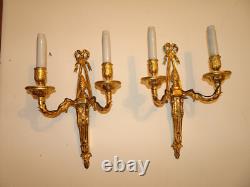 Pair of Louis XVI period sconces. Gilded bronze. Late 18th century, early 19th century.