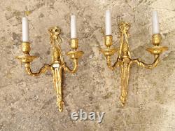Pair of Louis XVI period sconces. Gilded bronze. Late 18th century, early 19th century.