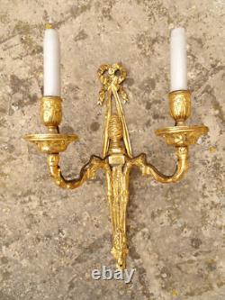 Pair of Louis XVI period sconces. Gilded bronze. Late 18th century, early 19th century.