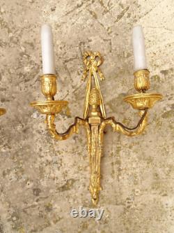 Pair of Louis XVI period sconces. Gilded bronze. Late 18th century, early 19th century.