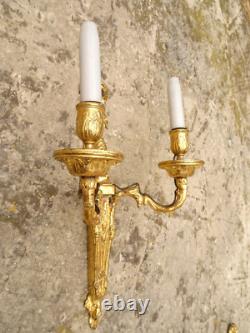 Pair of Louis XVI period sconces. Gilded bronze. Late 18th century, early 19th century.