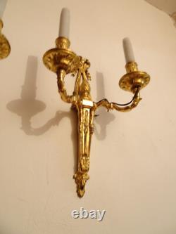 Pair of Louis XVI period sconces. Gilded bronze. Late 18th century, early 19th century.