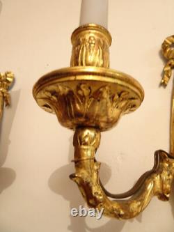 Pair of Louis XVI period sconces. Gilded bronze. Late 18th century, early 19th century.