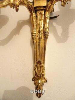 Pair of Louis XVI period sconces. Gilded bronze. Late 18th century, early 19th century.