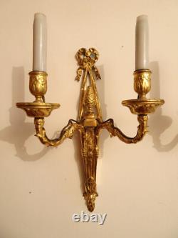 Pair of Louis XVI period sconces. Gilded bronze. Late 18th century, early 19th century.