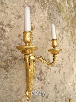 Pair of Louis XVI period wall sconces. Gilt bronze. Sconces. Late 18th century, early 19th century.