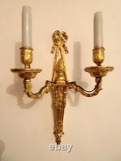 Pair of Louis XVI period wall sconces. Gilt bronze. Sconces. Late 18th century, early 19th century.