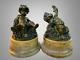 Pair Of Bronze Patinated Putti Resting On Marble Bases From The 18th/19th Century
