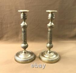 Pair of candlesticks / torch holders from the EMPIRE RESTORATION period in 19th century bronze
