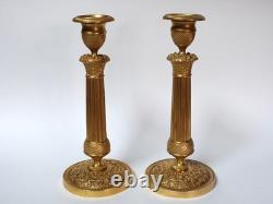 Pair of chiselled gilded bronze candle holders, Restoration period, early 19th century