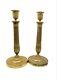 Pair Of Gilded Bronze Candlesticks From The Early 19th Century Empire Period.