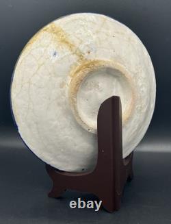 Persian faience dish with polychrome bird and flower decoration, Qajar period, 19th century