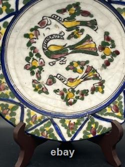 Persian faience dish with polychrome bird and flower decoration, Qajar period, 19th century