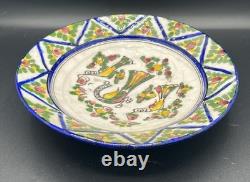 Persian faience dish with polychrome bird and flower decoration, Qajar period, 19th century