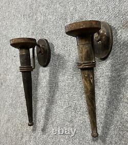 Rare pair of medieval-style torch sconces in 19th century iron