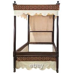 Renaissance-style walnut canopy bed from the 19th century