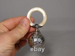 Solid silver and mother-of-pearl baby rattle, 19th century
