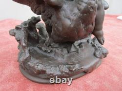 Statuette of a Cherub Holding a Goose, 19th century, bronze