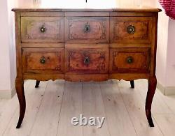 Transition period walnut and marquetry commode with projecting front