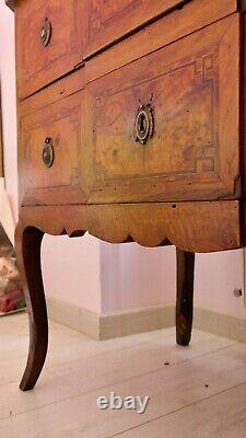 Transition period walnut and marquetry commode with projecting front