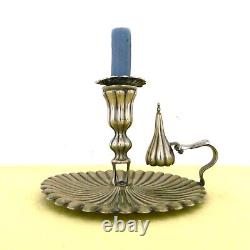 Translation: Large handheld candlestick and its snuffer, silver-plated (brass) from the 19th century.