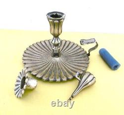 Translation: Large handheld candlestick and its snuffer, silver-plated (brass) from the 19th century.