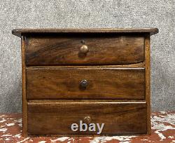 Watchmaker's cabinet / compartmentalized walnut chest from the 19th century