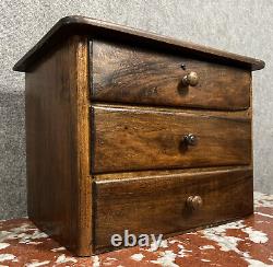 Watchmaker's cabinet / compartmentalized walnut chest from the 19th century