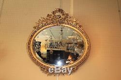 Ancien et grand miroir ovale doré de style Louis XVI époque XIX ème siècle