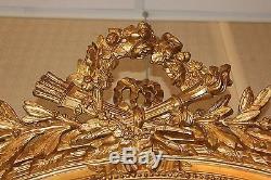 Ancien et grand miroir ovale doré de style Louis XVI époque XIX ème siècle