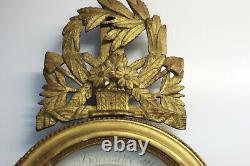 Baromètre ovale Epoque XIX eme en bois doré décor de panier fleuri FOULON Paris