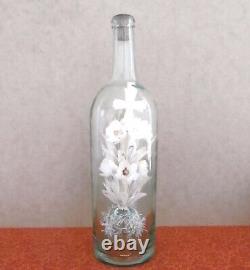 Bouquet de cérémonie dans une grande bouteille en verre soufflé d'époque XIXème