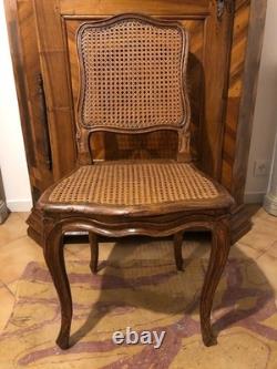 Chaise cannée Louis XV en hêtre scuplté. France, époque XVIIIe