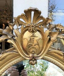 Grand miroir ovale en bois et stuck doré époque XIX ème siècle