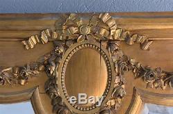 Miroir en bois et stuc doré d'époque XIXème de style Louis XVI