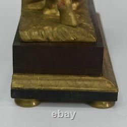 Pendule à automate d'époque Empire en bois doré XIXème