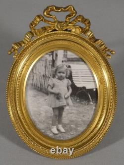 Petit cadre photo ovale en bronze doré style Louis XVI, époque XIX ème