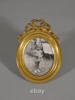 Petit cadre photo ovale en bronze doré style Louis XVI, époque XIX ème